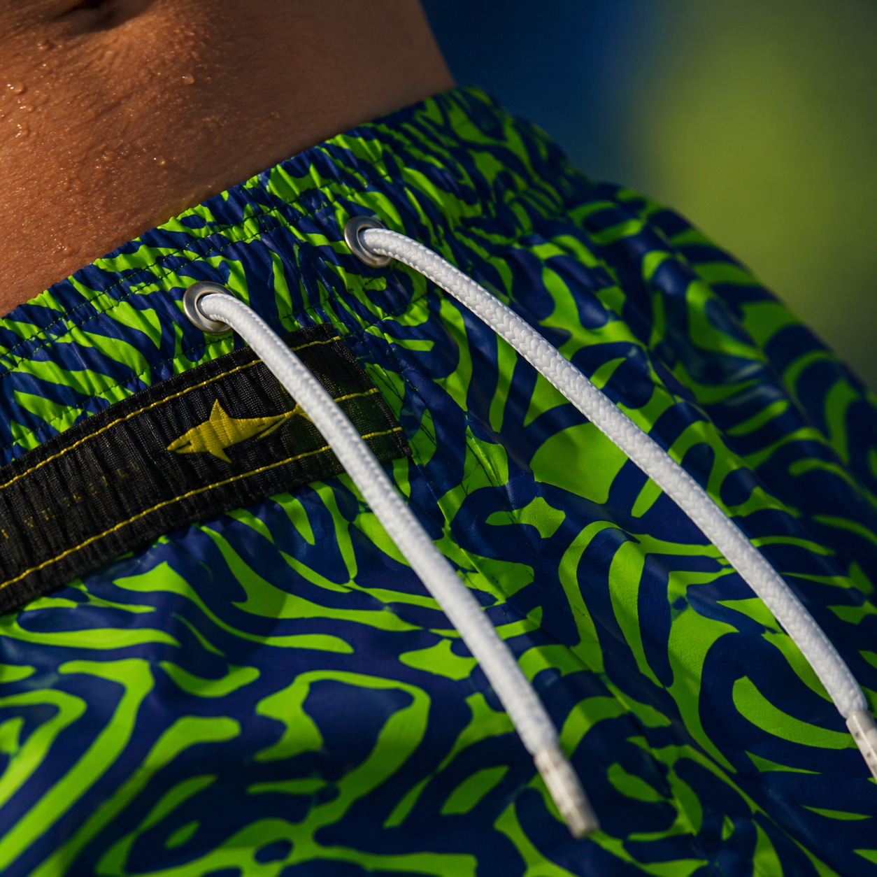 Neon Coral Reef Swim Trunks — Green & Navy All-Over Print Printify bakabo.club